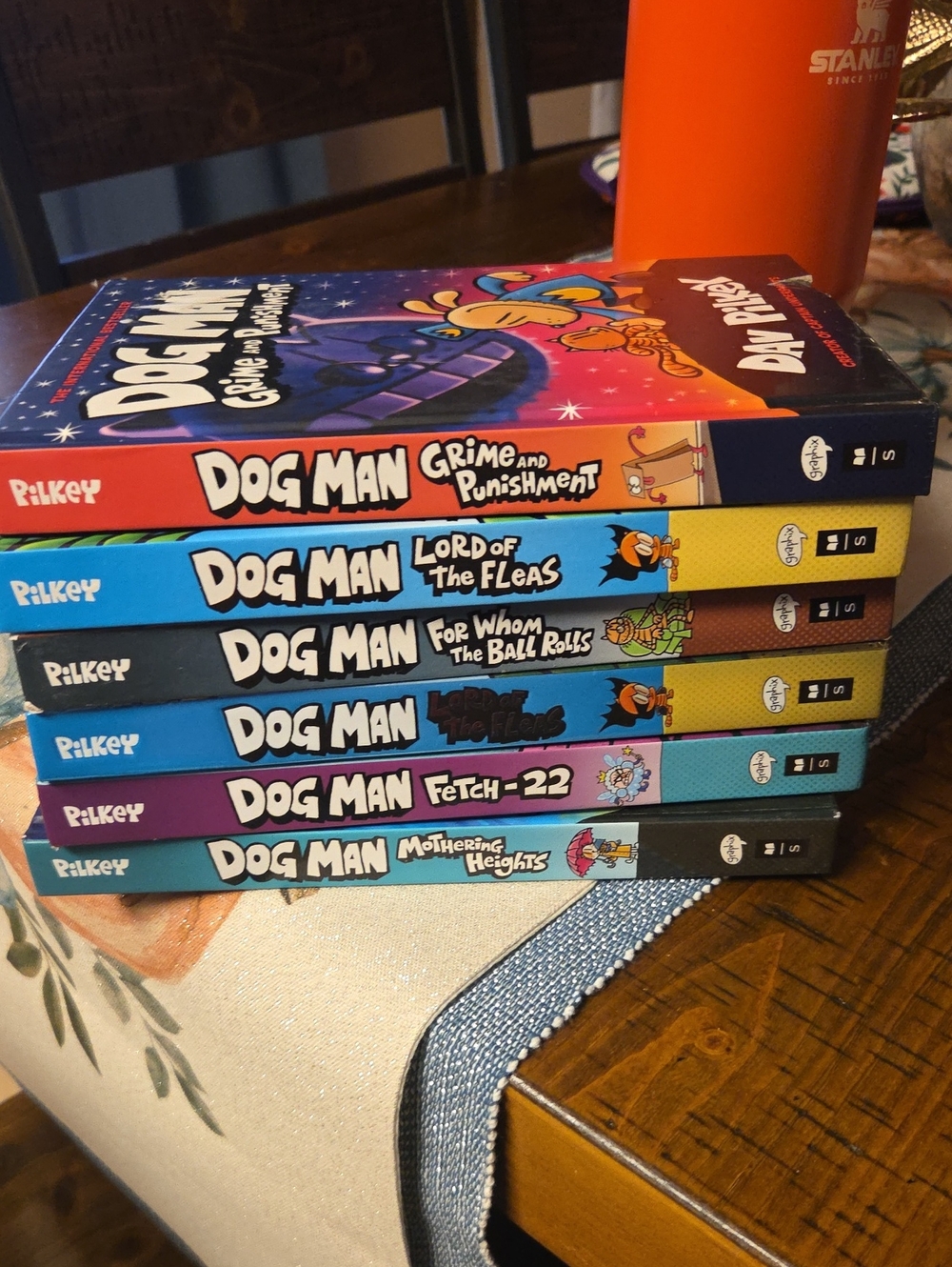 Dog Man Book Set Of 6 by — Blue, Purple, Yellow, Teal, Black Spines